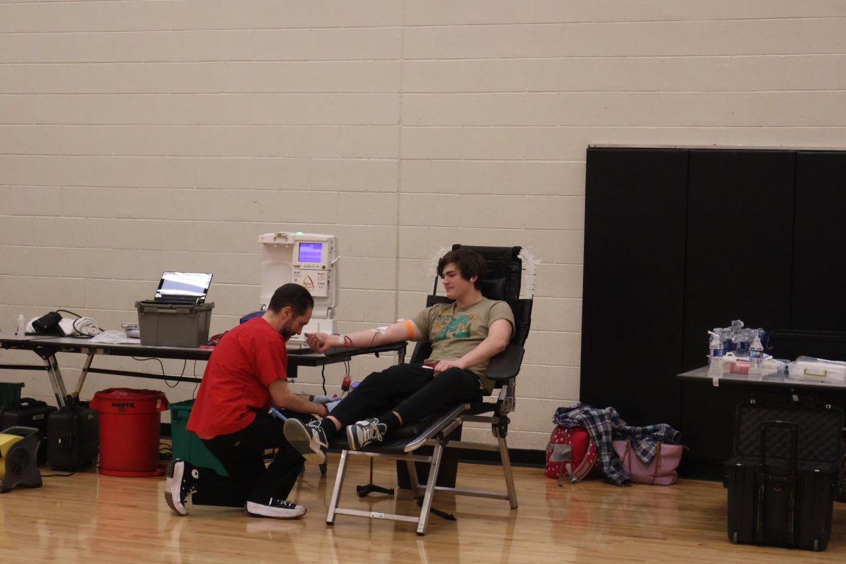 Giving blood,senior Christopher Curtis donates to the local blood drive. On Feb. 2, Fenton High School held their second annual blood drive for students. 
