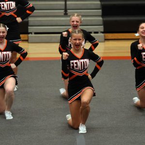 Cheering, sophomore Lauren Chapple competes in round one of their competition. On Feb. 2, Fenton Cheer takes 2nd place at the Tiger Invite.