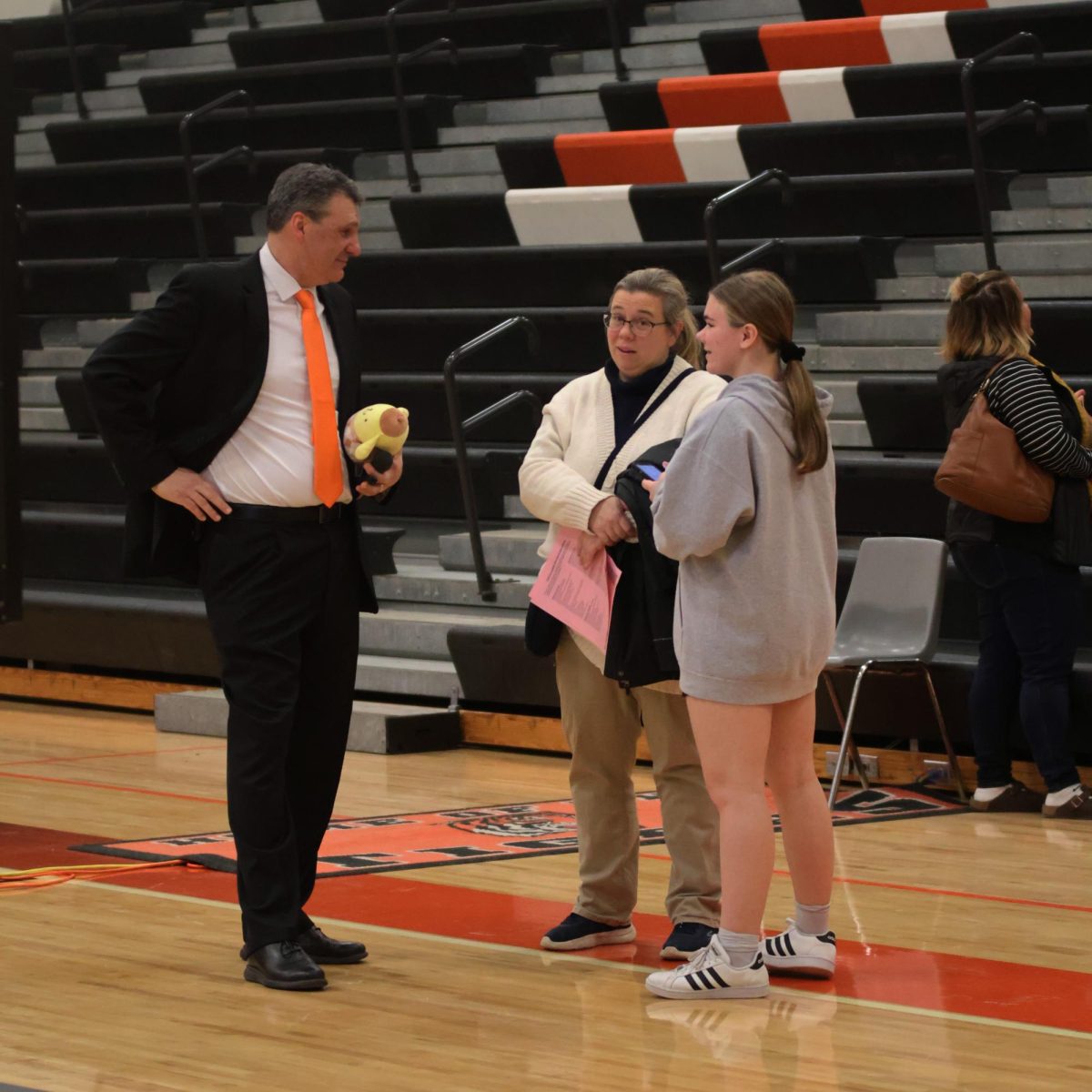 Helping a student, Principle Michael Bakker meets an incoming eighth grader. On Feb. 5, Fenton High School holds their eighth grade transition night.