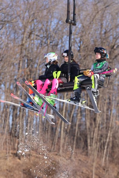 Sitting on the chairlift, sophomores Elyse Sturm and Claire Weir head to the top of the ski hill to get ready to compete. On feb. 20, the LFG ski team competed in regionals.