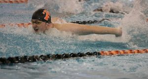 Swimming, senior Isaac Gurnsey took part in a competition. On Feb. 24, the FHS boys swim team competed in the Flint Metro League.