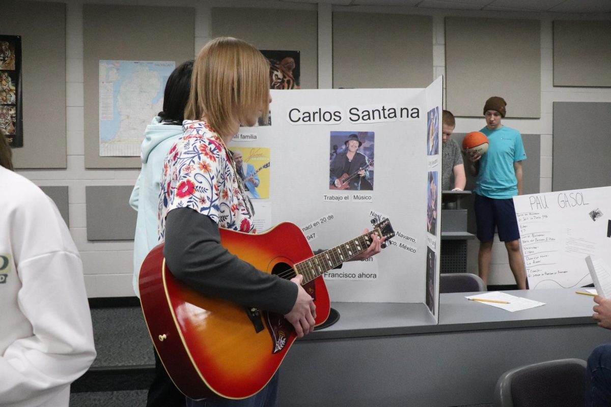 Holding+a+guitar%2C+Sophomore+Caleb+Wolner+plays+a+song+for+students.+On+Mar.+20%2C+Spanish+2+dressed+up+for+a+wax+museum.++