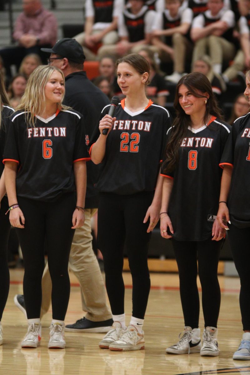 Speaking into the mic, junior Maddie Sheffield introduces herself as a player on the girls varsity soccer team. On March 18, the spring sports teams participated at Meet the Team night at Fenton High School.