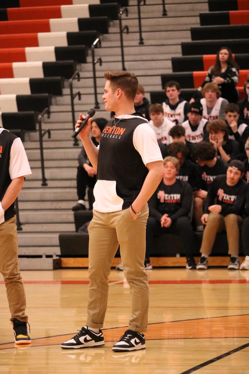 Talking+into+the+microphone%2C+senior+Nolan+Alvord+announces+his+teammates+names.+On+March+18%2C+the+spring+meet+the+teams+was+held+in+the+FHS+gym.+