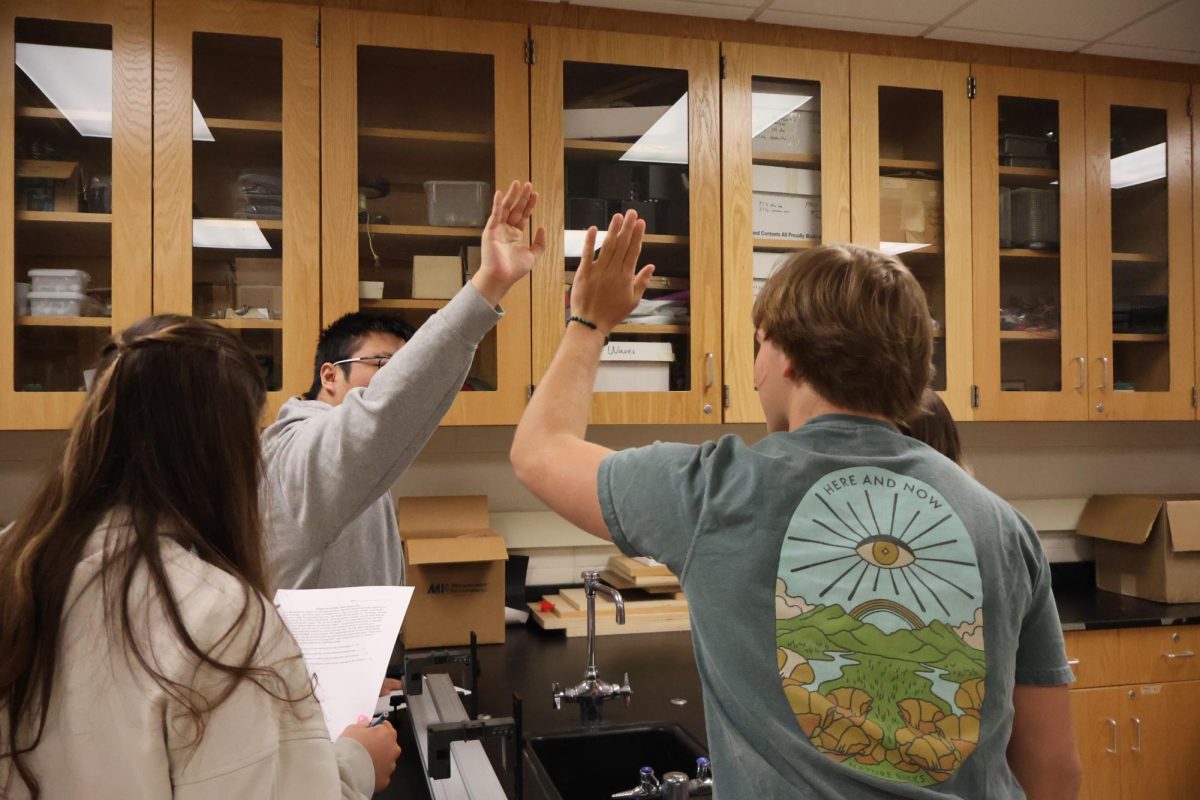 Teamwork, sophomores Junrui Yan and Hayden Weaver complete a lab. On April 11, science teacher Jason Kasak held an energy on inclined tack inquiry lab for students. 