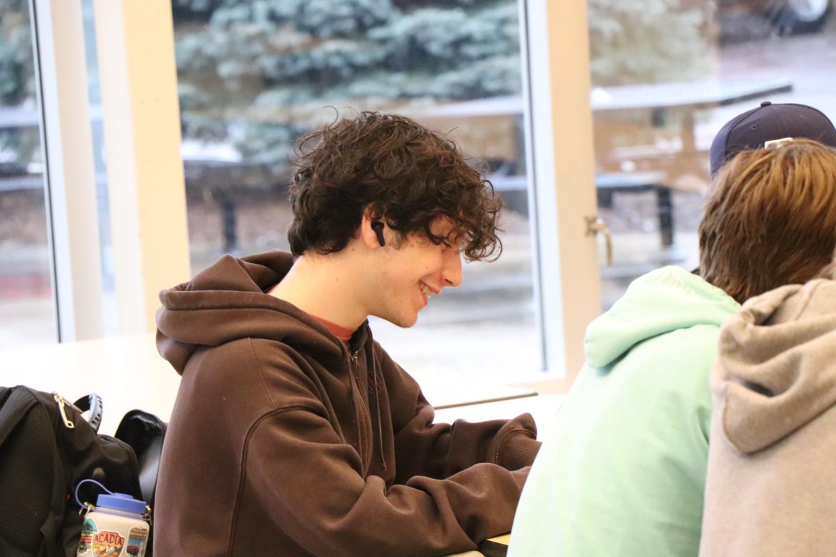Smiling, Sophomore Samuel Carnes laughs with his friends. On April 12, AMS filmed videos for a project.  
