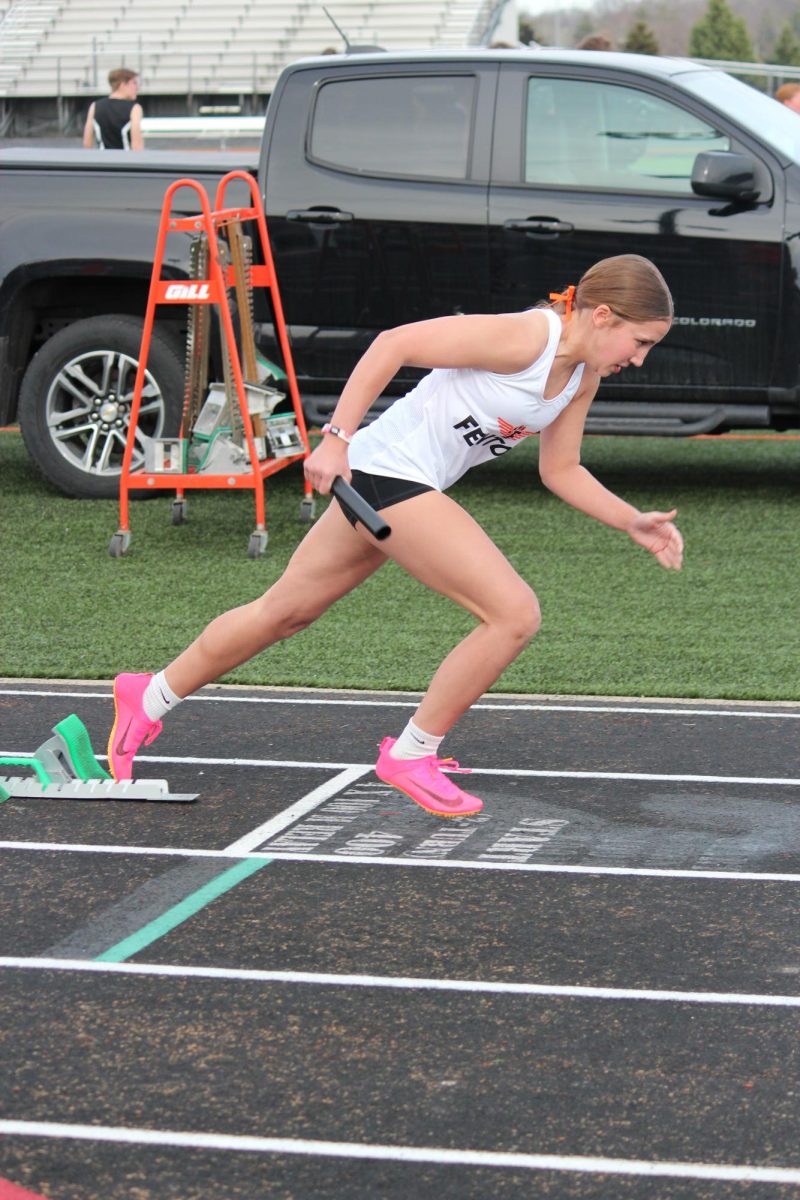Getting prepared, Freshman Madison Eltringham runs in her race. On Apr. 10, Fenton girls track played against Linden and won.  