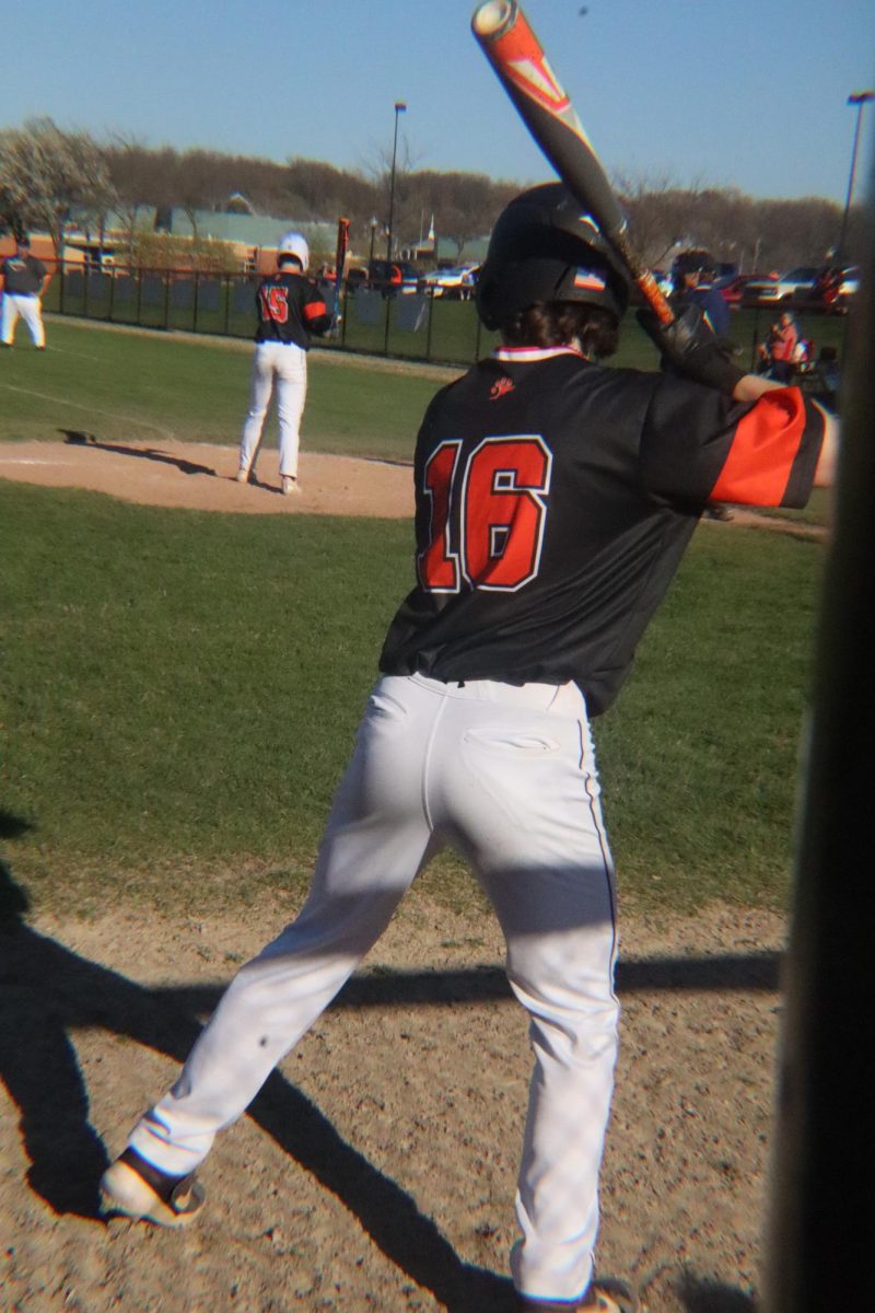 Swinging, number 16 practices for his turn at bat. On April 15, the JV baseball team had a double header against Holly.