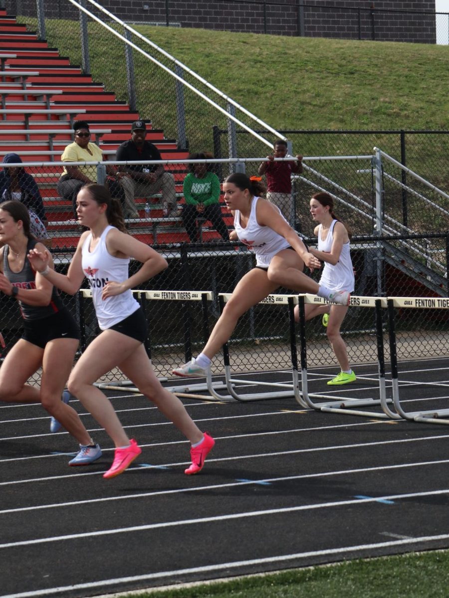 Hurdling, Junior Anna Logan runs the 100 meter hurdles. On April, 10th the track team won against Linden 78 - 59.