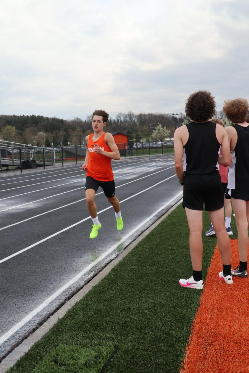 Running%2C+sophomore+Dillon+Hamilton+gets+cheered+on+by+his+teammates.+On+April+17th+the+track+team+won+against+Swartz+creek+121+-+15.