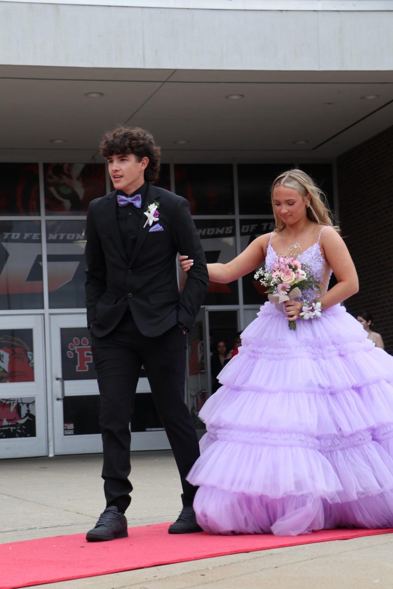 Walking+on+the+red+carpet%2C+Sophomore+Cash+Guerra+and+Junior+Lydia+Clemons+attended+prom.+On+April+20%2C+Fenton+highschool+organized+Prom.