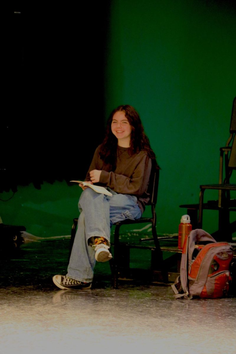 Smiling, junior Isabella Buztine participates in her rehearsal. On April. 5, IB Theater got together to rehearse for their upcoming event.