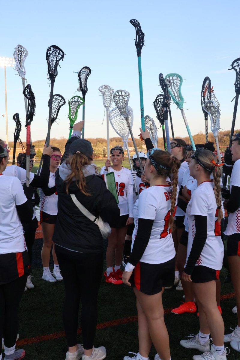Chanting, the heat lacrosse team comes together before the game. On Apr. 19, the girls won against Holly. 