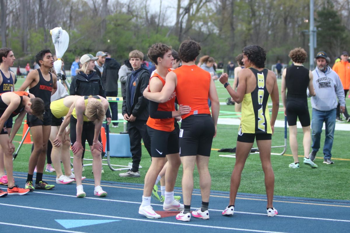 Congratulating each other, junior Jake Huntoon and sophomore Dillon hamilton run the open 800 race. On April 26, the boys track team ran at the Grand Ledge Comet Classic and came in 8th place.  