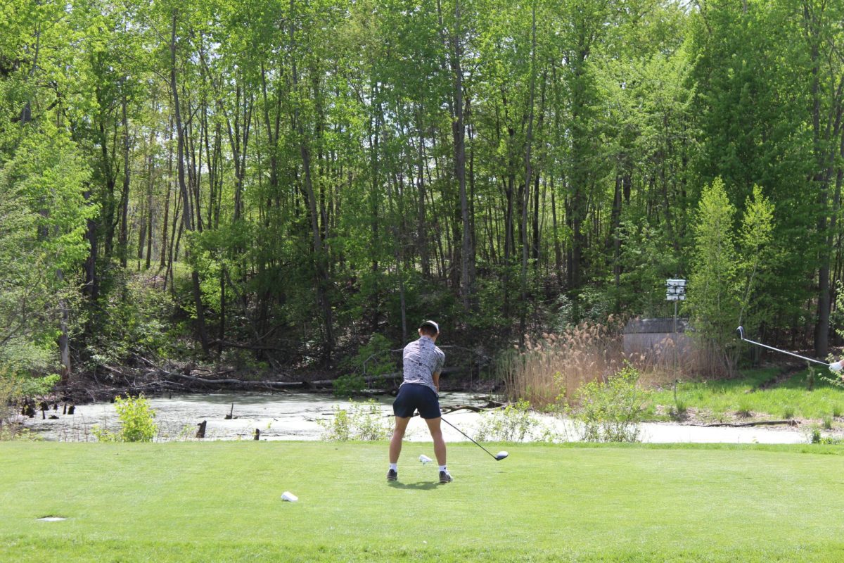 Aiming to hit the ball, senior Hank Wojtaszek gets ready to swing. On May 6, Fenton played against Clio.