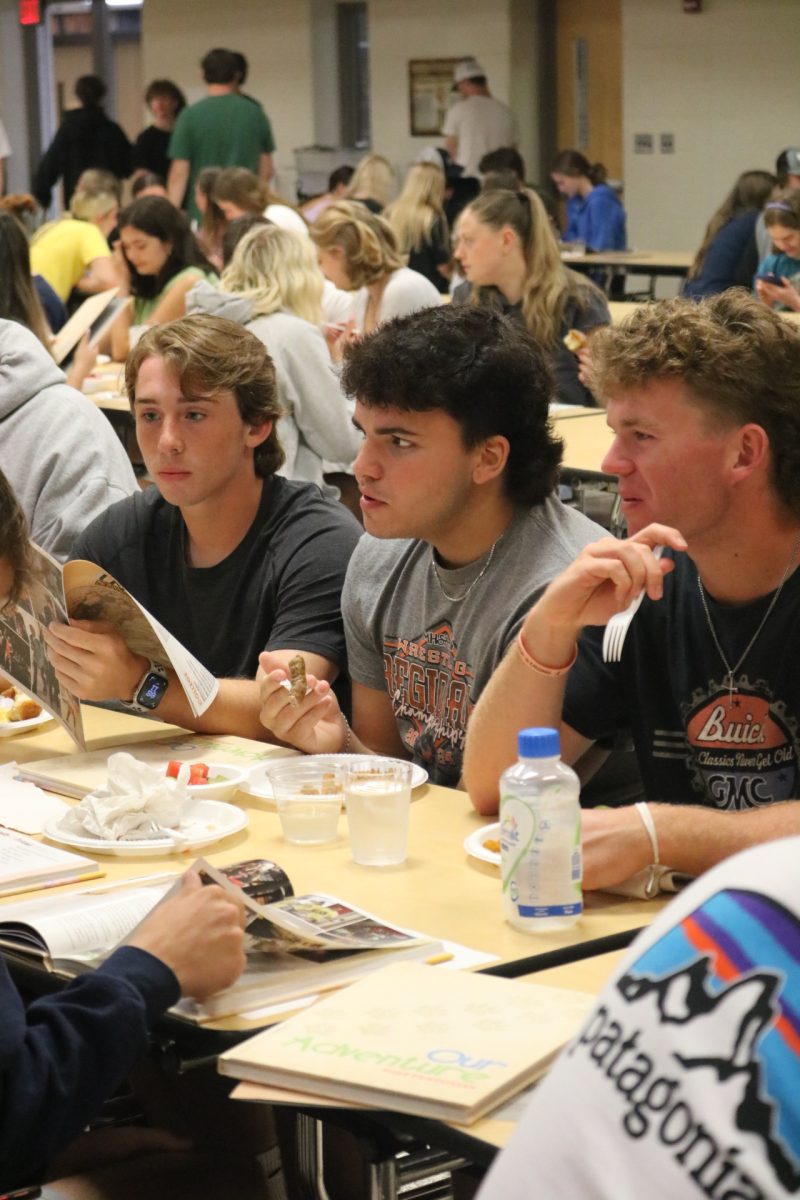 Eating, senior Carson Krzeszak attends a senior breakfast. On May 21 the Fenton Highschool held a breakfast to congratulate the graduating seniors.