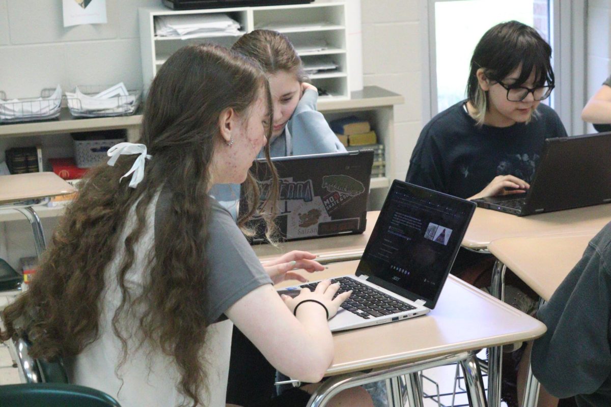 Concentrating, Freshmen Emma Roberts researches information for a project. On May 2, the 9th grade honors classes did a time travel research project. 