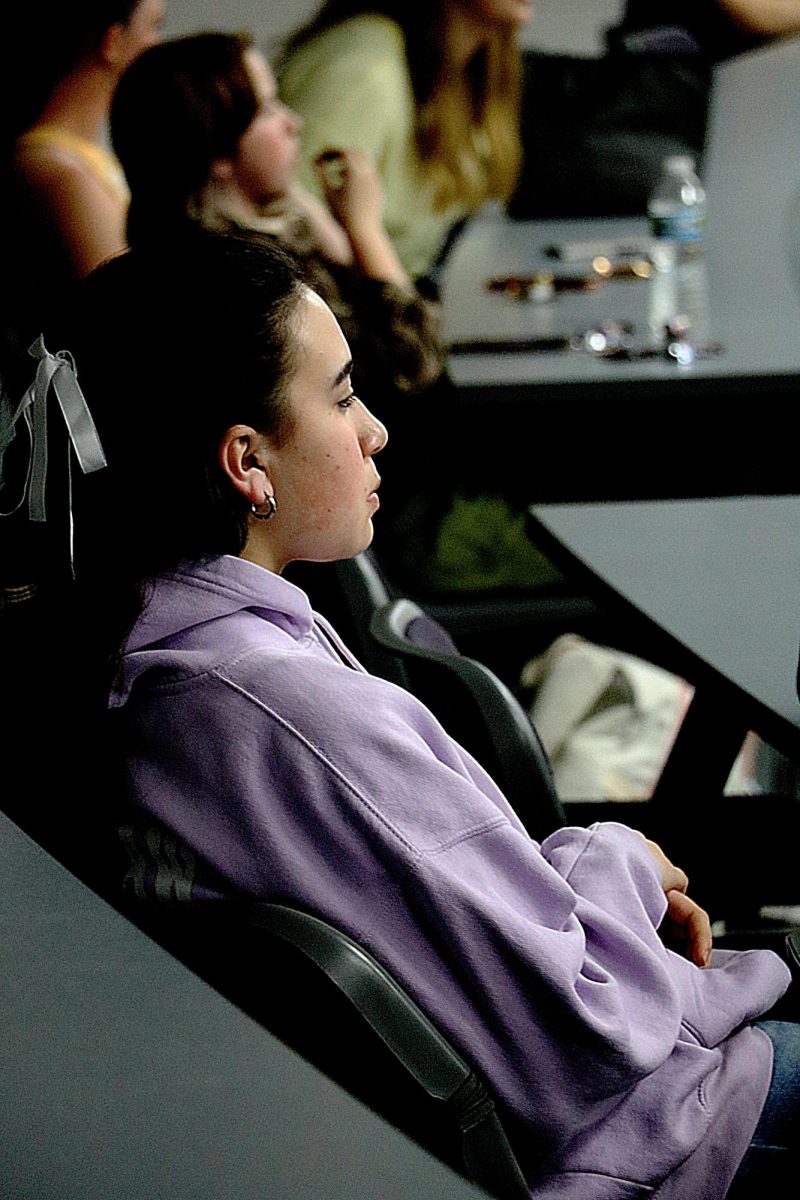 Waiting, freshman Janessa Bemman pays attention during a presentation. On May. 16, Key Club meets in the lecture hall for their final meeting. 