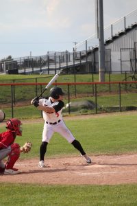 Ready to swing, senior Nolan Alvord prepares to hit. On May 13, the varsity baseball team played Swartz Creek losing 1-3.