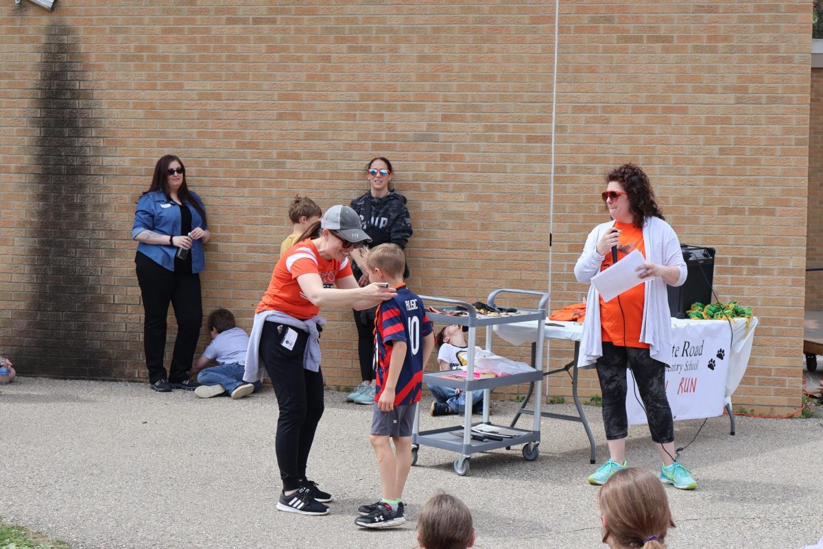 Announcing the winners, Ms. Slaughter waits to call the next person. On May 10, State Road Elementary held a Fun Run.