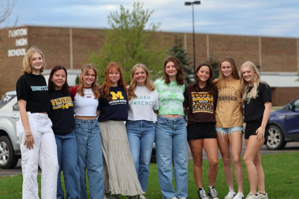 Posing%2C+nine+seniors+came+together+to+take+pictures.+On+May+1%2C+Fenton+High+seniors+represented+their+future+schools.+