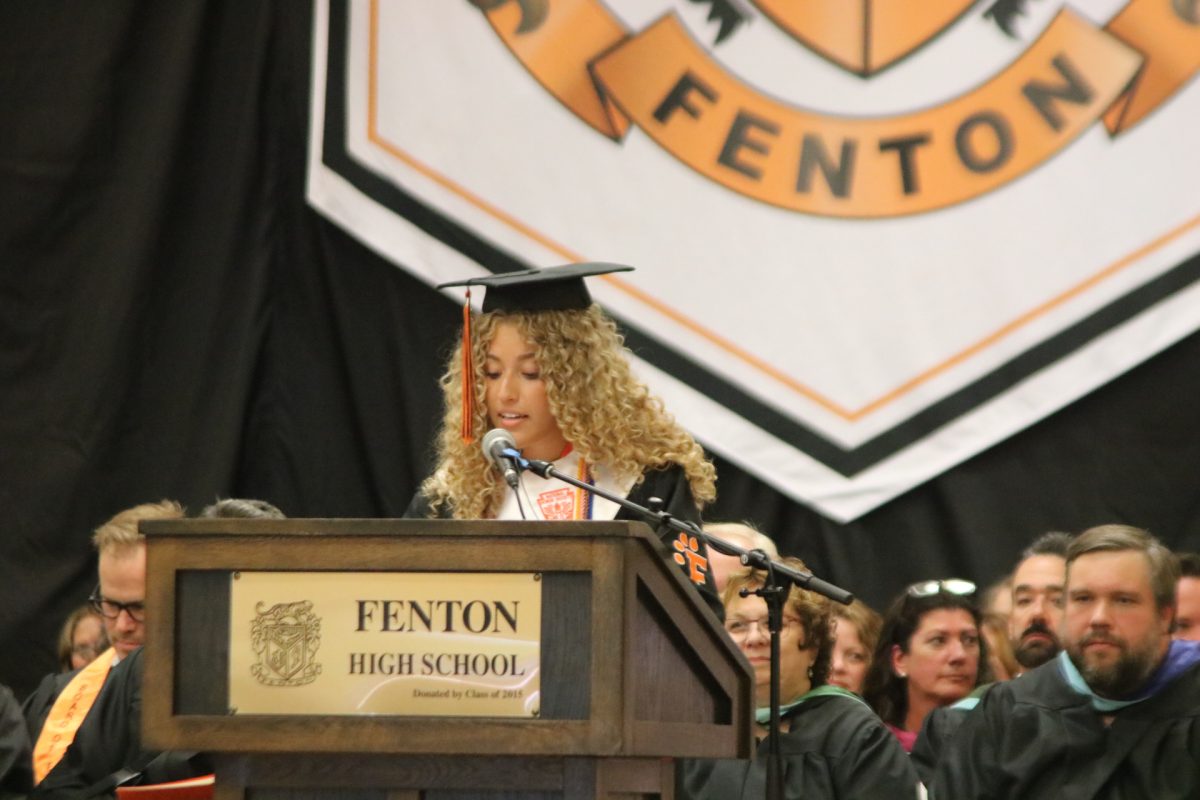 Looking down, senior Olivia Shampo voices her valedictorian speech. On May 23, ths seniors got honored for graduation. 