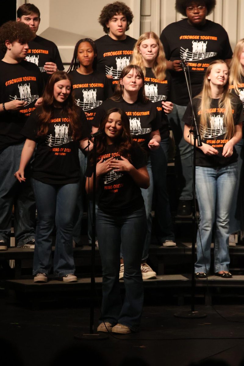 Singing, senior Emma Minock performed at a choir concert. On May 16, FHS hosted the last choir concert of the year.