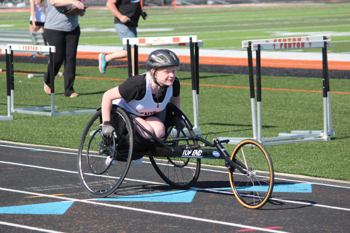 Molly Katic participates in track events racing in a wheelchair