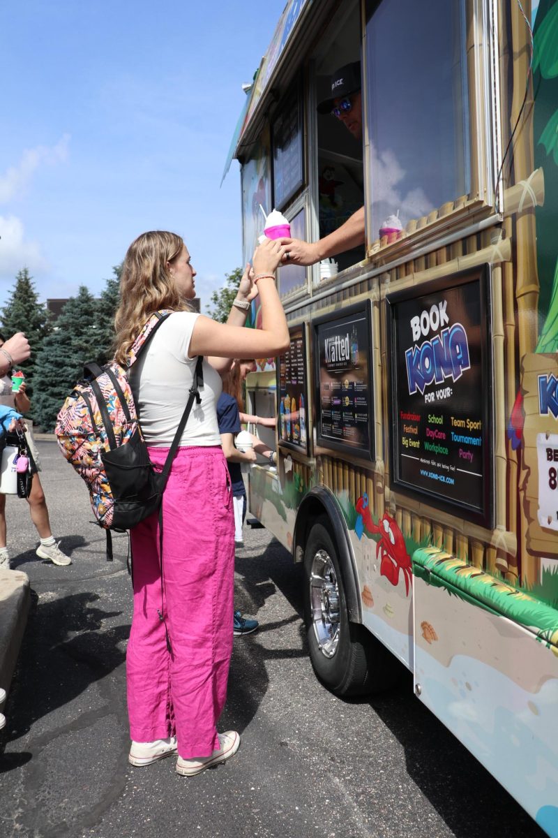 Getting Kona Ice, freshman Maryn Teddy takes her serving. On June 3, the Kona Ice truck came to FHS to help benefit the Publications program.