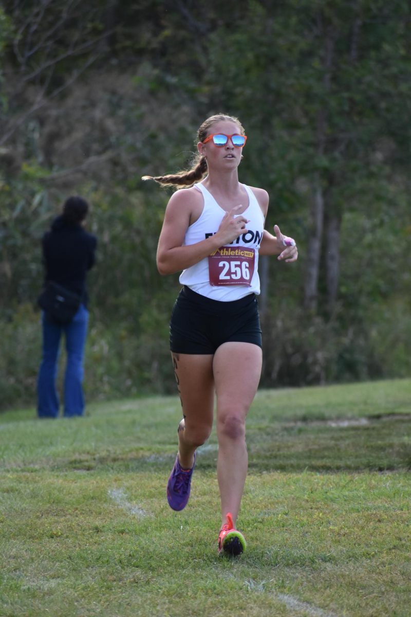 Running, senior Taryn Craven participates in a 5k race . On Sept. 25, the Fenton Cross Country team ran in a jamboree in Goodrich.