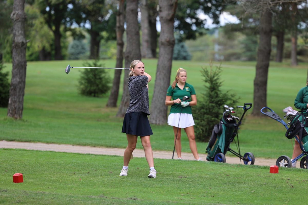 Hitting the ball, sophomore Payton Roney hits her driver at the tee box. On Sept. 25, The Fenton girls JV golf team played Howell and won 237-264.