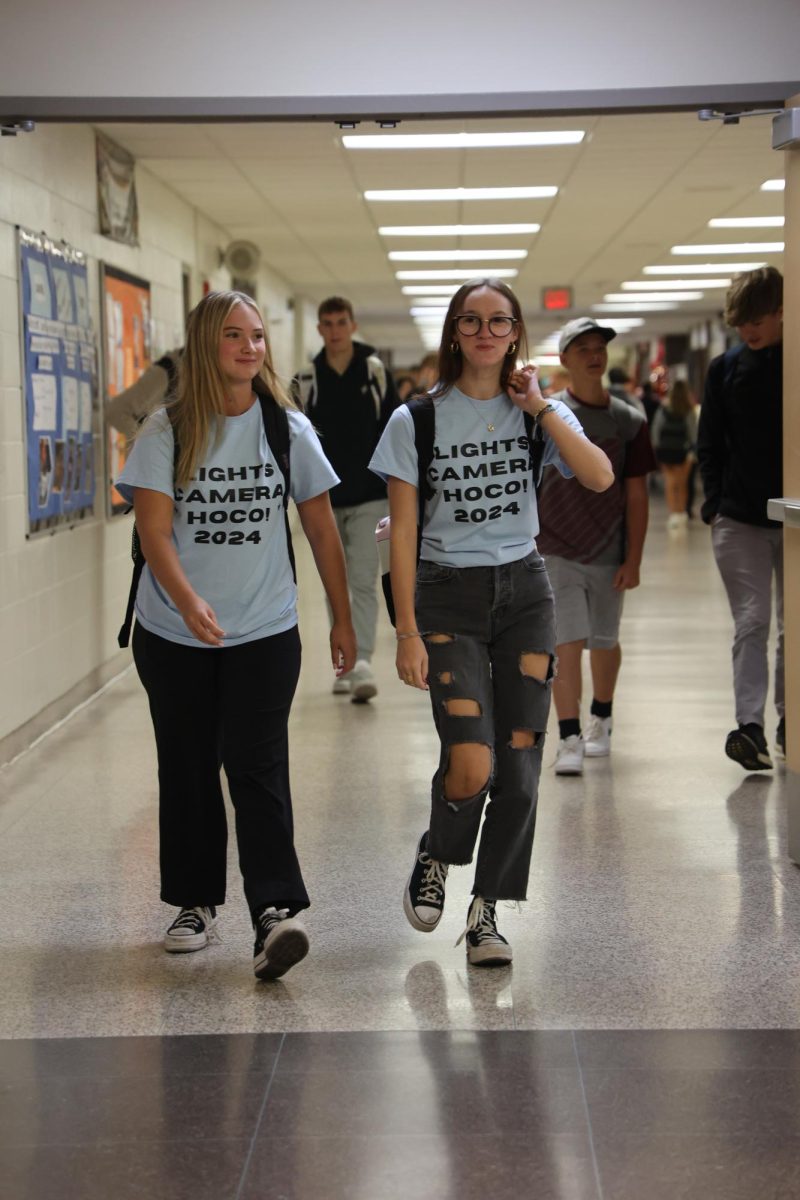 Showing their school spirit, seniors Remy Sharp and Lydia Clemons wear blue for color wars. On Sept. 26, FHS held Color Wars Day for homecoming spirit week.