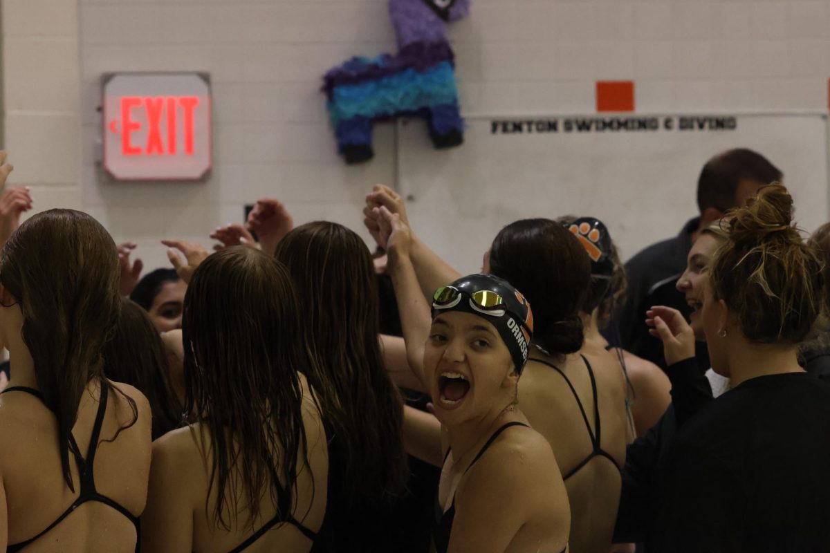 Chanting, sophomore Lexi Ormsby brings energy to the fenton swim and dive team. On september 5th the swim meet held a home meet.