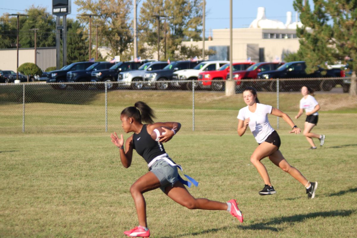 Running, Rayn Rutley is racing to get to the other side of the field. On Sept. 17 FHS seniors practiced for the annual powderpuff game. 