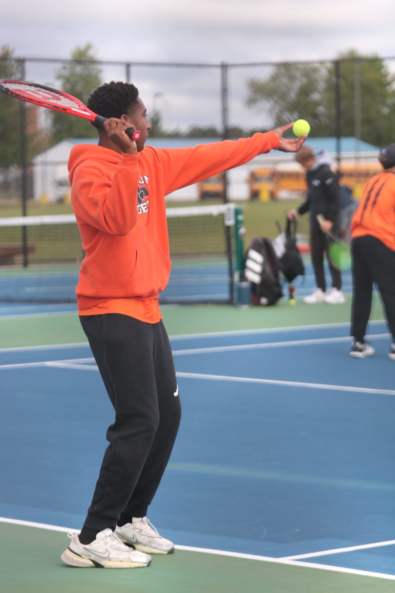 Playing, sophomore Jerome Montgomery looks at the ball. On Sept. 7, the FHS boys varsity tennis team went up against multiple opponents.