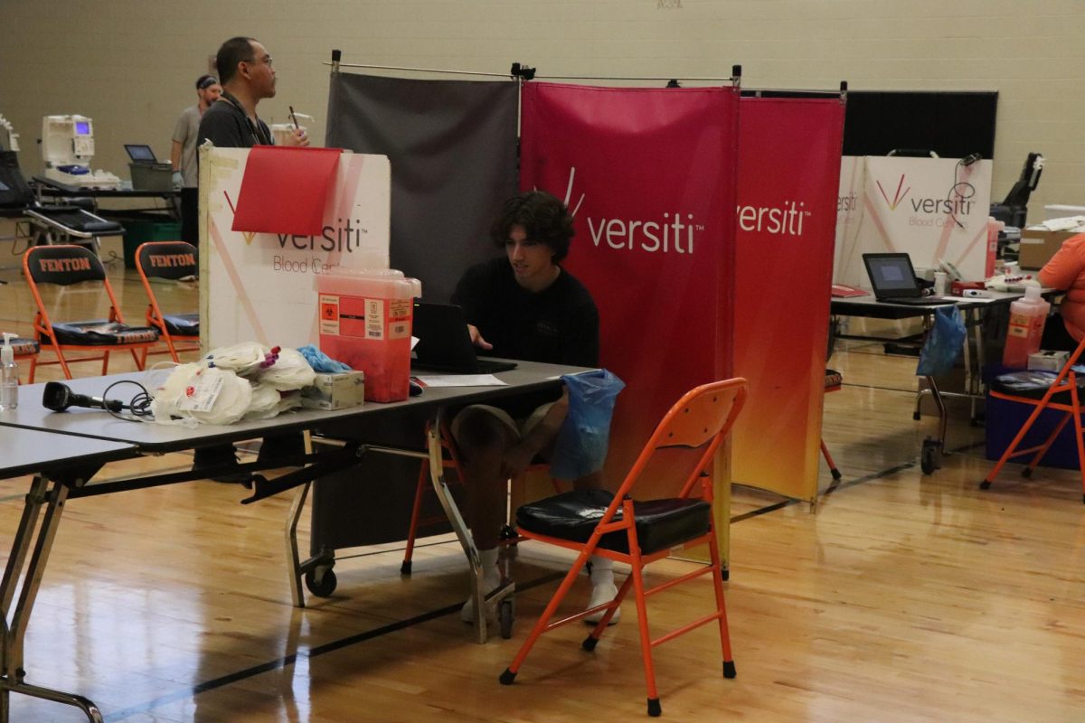 Getting ready to donate,Senior Owen Cox filling out information to Donate blood at the annual blood drive on September 6 2024