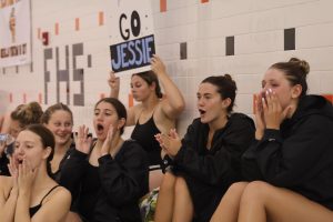 Cheering, The FHS swim and dive team support their teammates. On sept. 10th the swim team had a meet against  Walled Lake Northern and won 142 to 61.