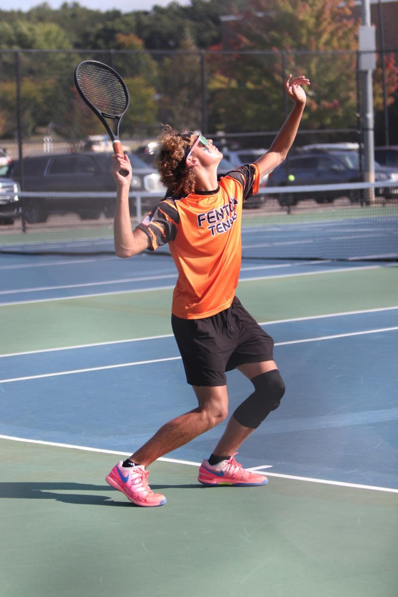 Looking, senior Kalib Matthys aims to hit the ball. On Sept. 19, the FHS boys varsity tennis team went up against Goodrich.