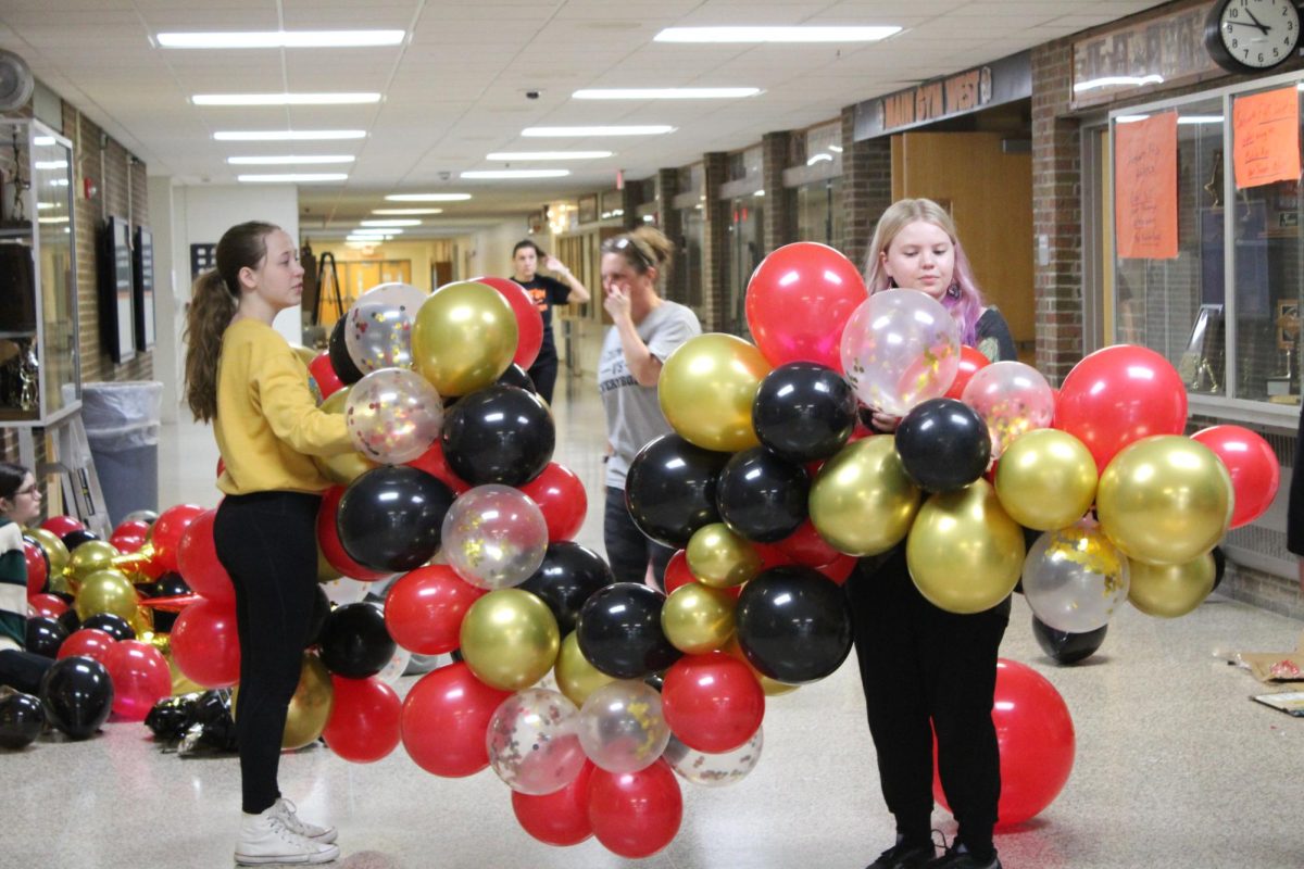 Putting together a balloon arch, Junior, Rhiannon Kaulongowski for the FHS Homecoming Dance. 9/28