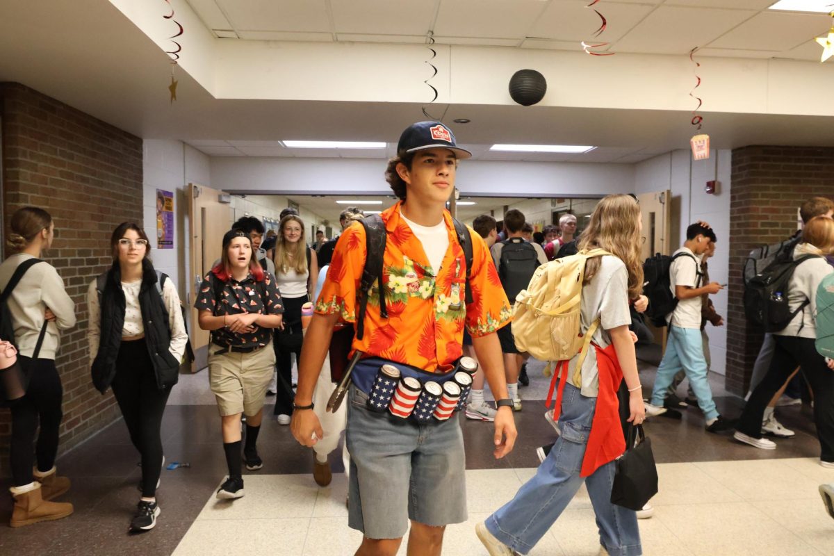 Dressing up, Junior Cash Guerra shows his school spirit by embracing his role as a BBQ dad. On Sept.24, the school held a spirit day called "Soccer Mom VS BBQ Dad".