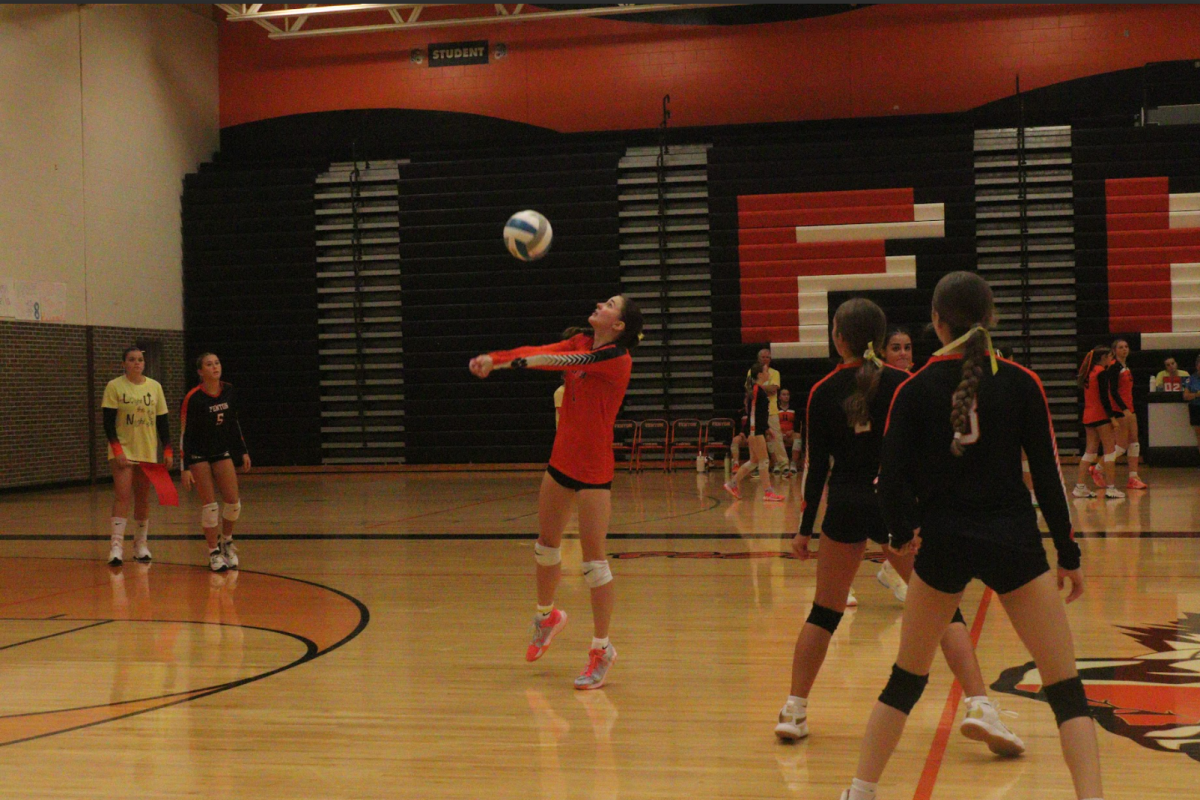 Digging a pass, Sophomore Kate Hunt is passing a ball to the setter. On Sept. 18 the Fenton JV volleyball team played Linden high school and won all three of their sets.  