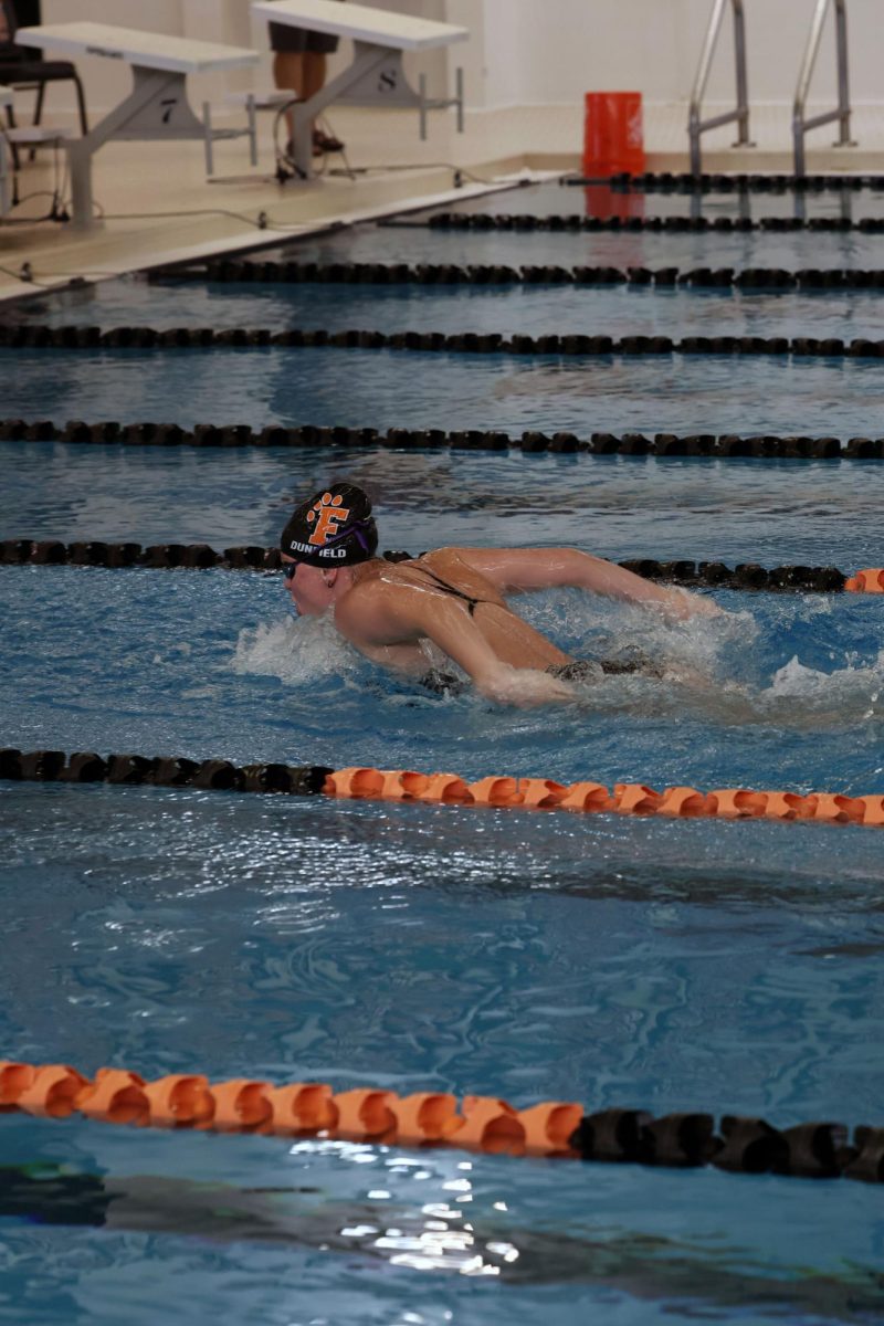 Going down the lane, sophomore Katie Dunfield swims the butterfly stroke. On Sept. 6, Fenton competed against Kearsley.  