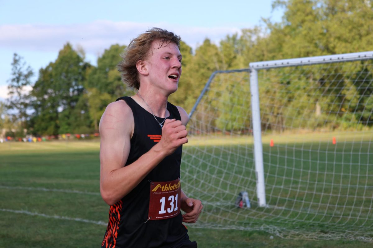 Running, Sophomore Jackson martin races at the goodrich 2nd league jamboree on sept. 25tth. Martin helped lead the tigers to a 2nd place finish