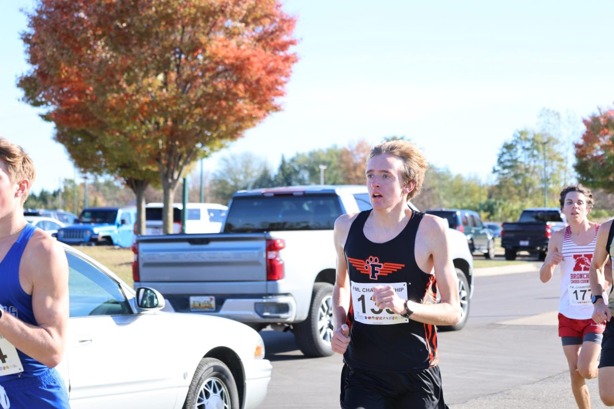 Running, senior Justin Perantoni competes in the cross country jamboree.On Oct. 16, the cross country team ran the 3rd league jamboree in lake fenton.