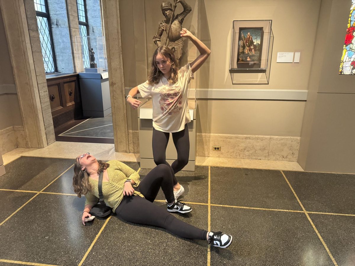 Posing, seniors Laila Blackwell and Ruby Wojtaszek copy a pose from one of the statues at the Detroit Institute of Arts. On Oct. 16, the International Baccalaureate Spanish and French classes had a field trip the Detroit Institute of Arts.
