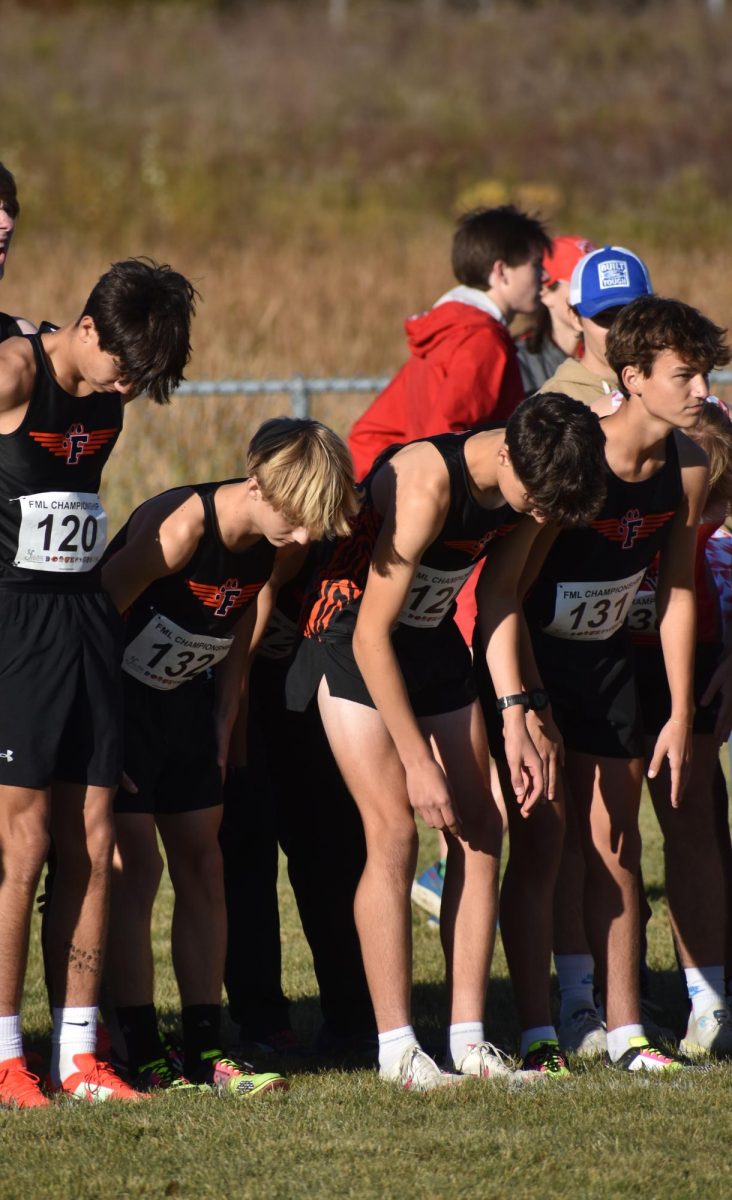 Preparing, freshman Zac Panter, Luke Battaglia and Luke Page along side sophomore Jackson Defina are on the line getting ready for their 5k race. On Oct. 16, the Fenton Cross Country team ran in a jamboree at Lake Fenton  Highschool.