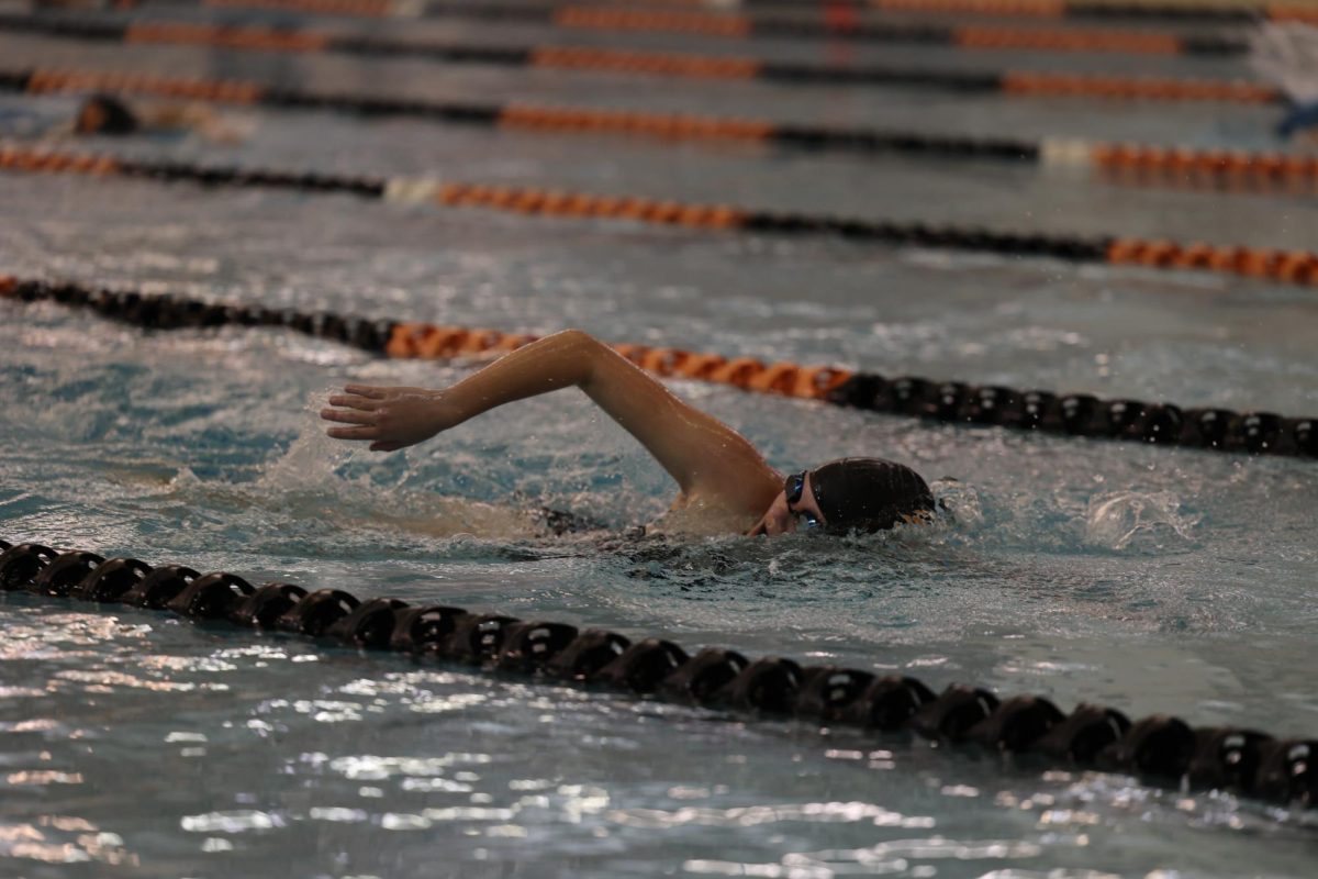 Taking a breath, freshman Izzie Murto swims the 500 free. On Oct. 10 the FHS Girls Swim and Dive team won their meet against Brandon-Goodrich.