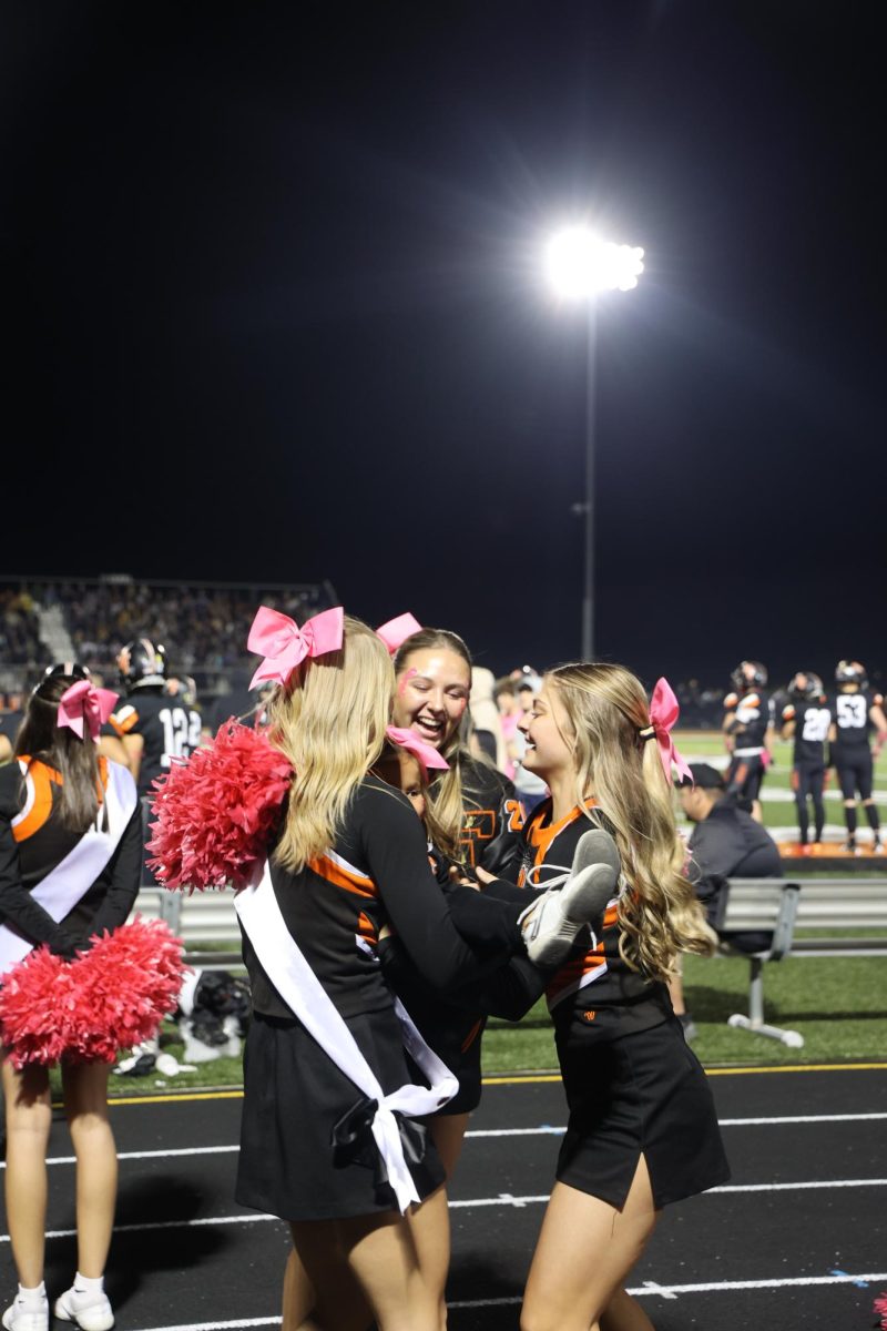 Laughing, junior Audrina Becker catches her flyer. On Oct. 19, Fenton played their last game of the season.  