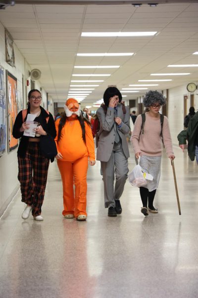 Walking, senior Brooke Waters and her classmates dress up to participate in Halloween Spirit Week. On Oct. 28, FHS held a Movie Monday for the first day of spirit week.