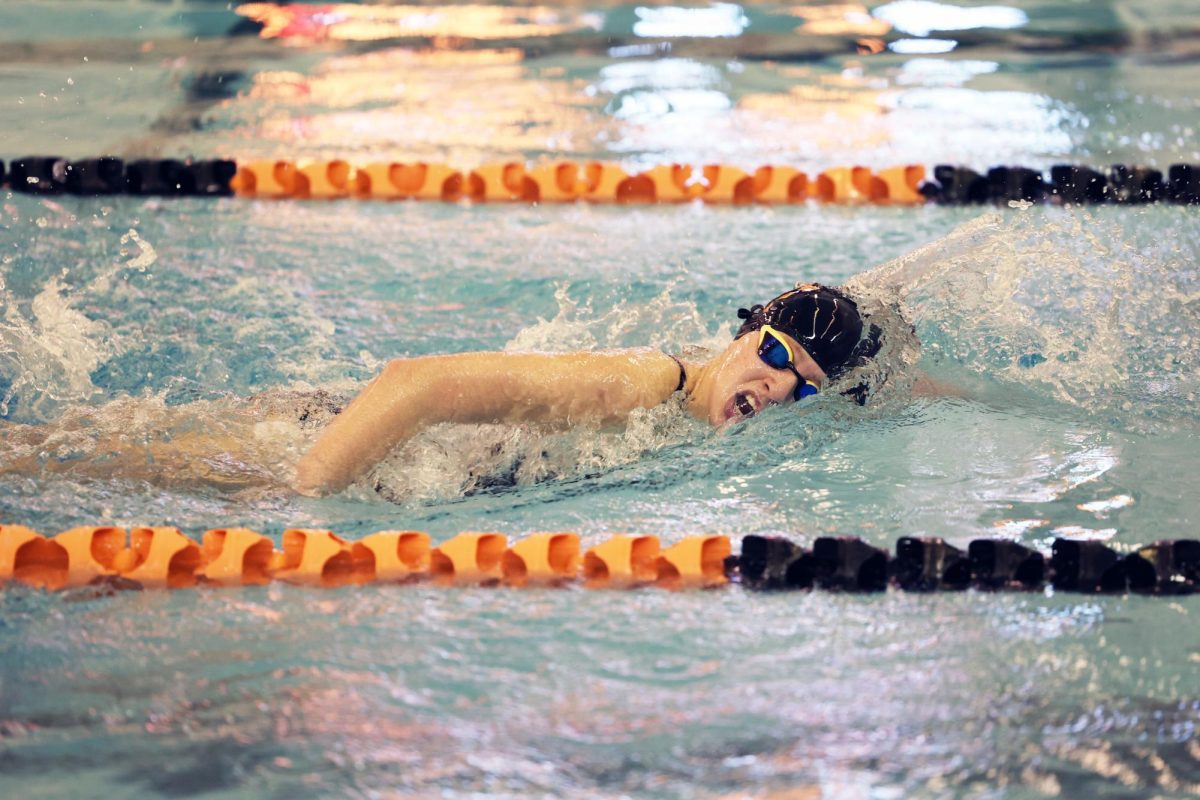 Swimming, junior Laynie Barz competes in the 500 freestyle to try to try to qualify for MISCA meet. On Oct. 1, The FHS girls varsity swim team swam against Midland Dow and lost by 10 points.